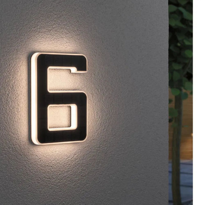 Illuminated house numbers powered by solar, providing bright, energy-efficient outdoor lighting.