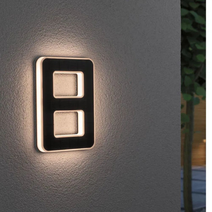 Elegant solar LED house number display "456", offering clear address visibility for guests.