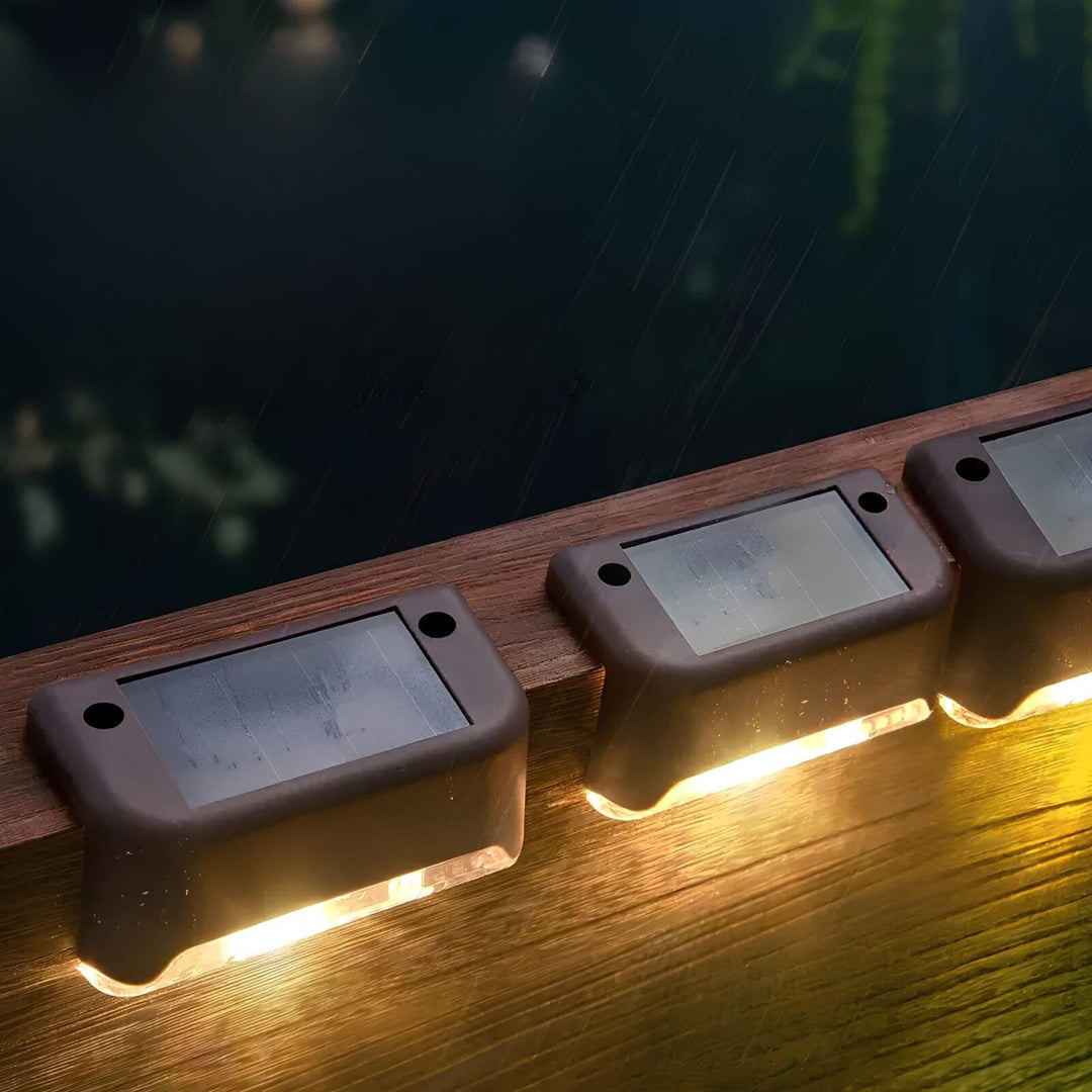 Installation image of a SoliStep Solar LED Step Light, showing simple setup for outdoor pathway illumination
