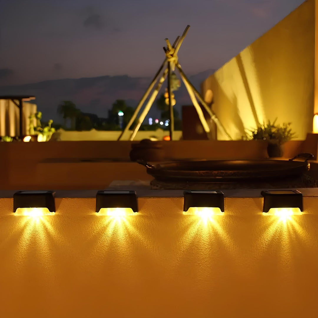 SoliStep Outdoor Solar LED Step Light in a garden setting, blending seamlessly with landscape decor