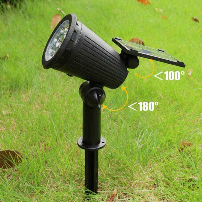 Two outdoor solar spotlights highlighting a garden statue, showcasing energy-saving landscape illumination