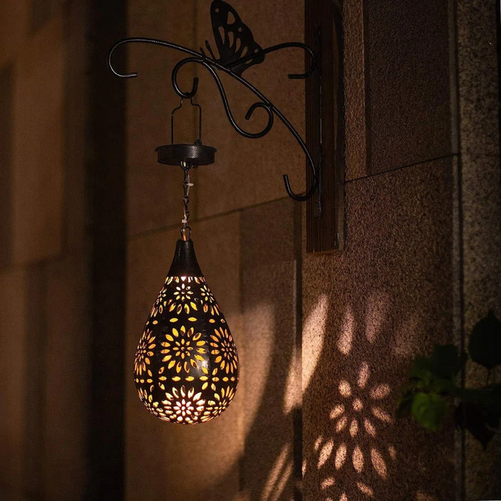 Decorative solar hanging lantern, ideal for outdoor garden and patio lighting. Automatic & energy-saving.