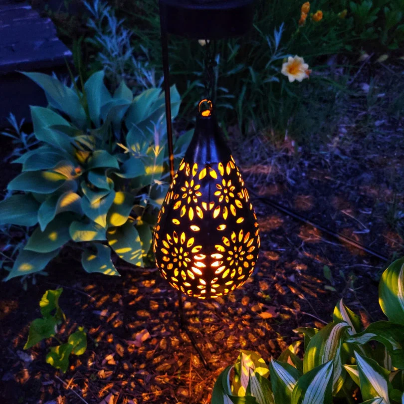 Eco-friendly solar lantern for outdoor spaces. Provides warm ambiance light for gardens, patios. Weatherproof.