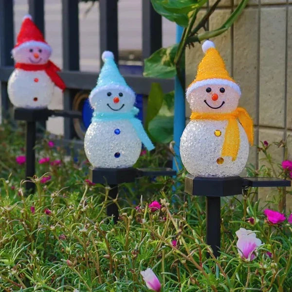 Solar snowman garden stake light, perfect for lining paths or decorating outdoor Christmas displays.