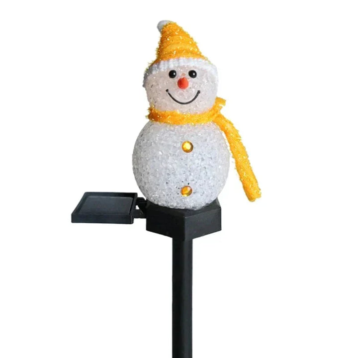 Whimsical solar snowman garden light, bringing joyful Christmas spirit to your outdoor patio decor.