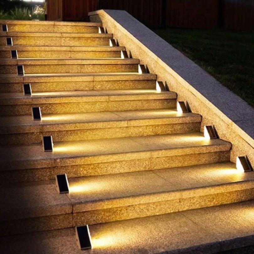 Outdoor solar step lights for stairs & pathways. Waterproof, energy-efficient LED lighting enhances garden safety.