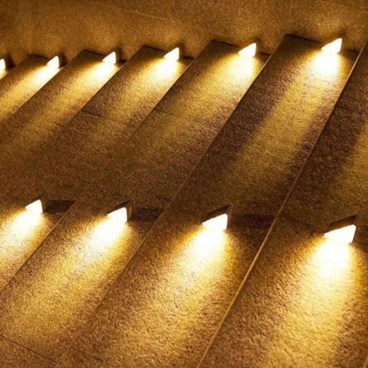 Wireless solar stair lights installed on outdoor steps, providing eco-friendly pathway lighting & ambiance.