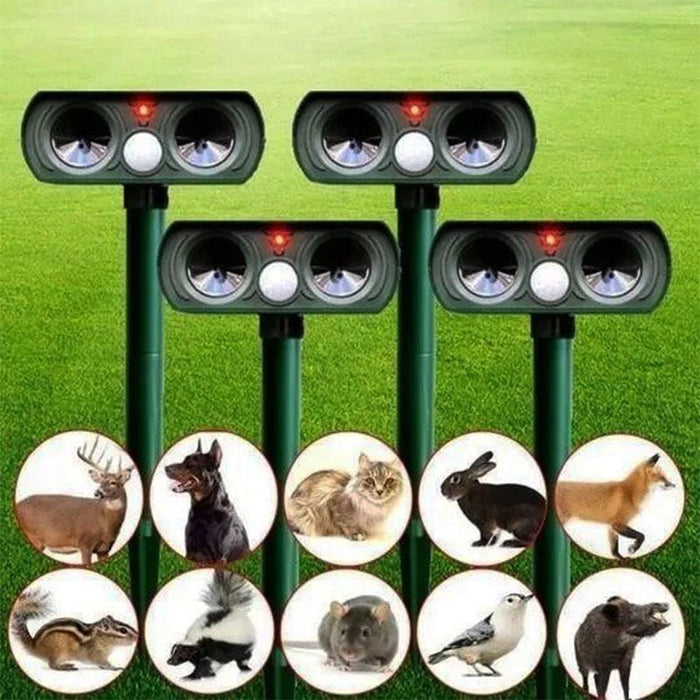 Solar animal pest repeller for easy yard defense, placed in garden, humane wildlife deterrent.