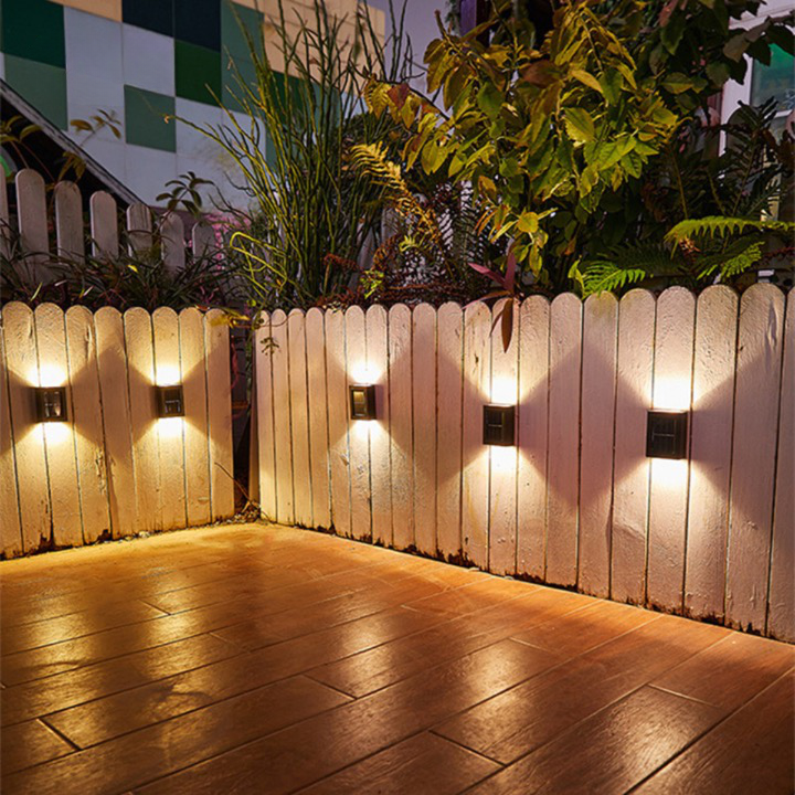 Modern outdoor LED solar wall light, automatic security lamp for garden, patio. Wireless & energy efficient.