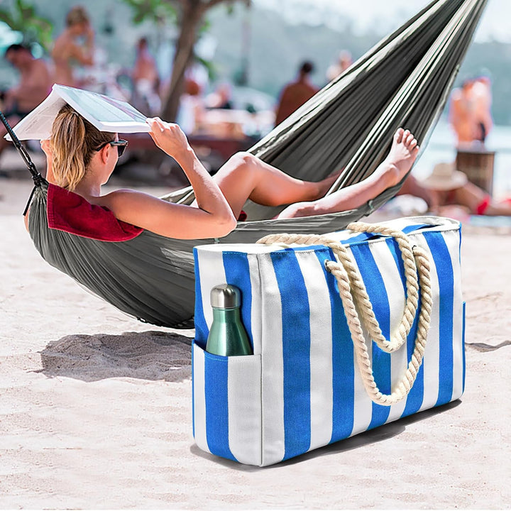 Waterproof beach tote with secure closures, keeps sand out & belongings safe.