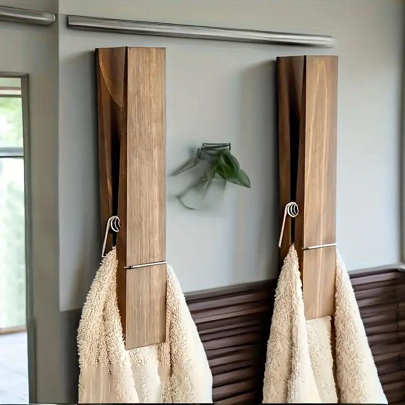 Oversized wooden towel clamp set, stylish bathroom organization. Solid wood wall hooks for home decor.