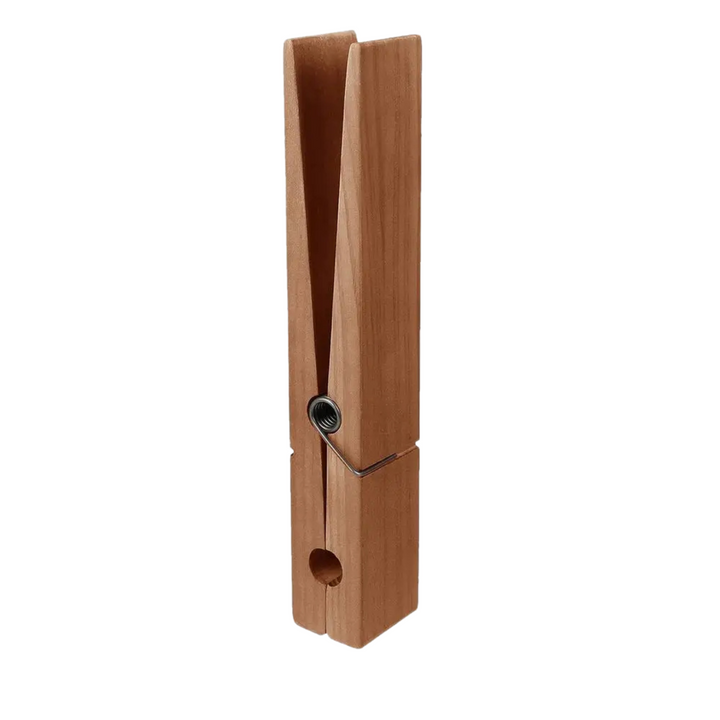Innovative solid wood towel clamps, unique wall hooks designed for secure and decorative towel hanging.