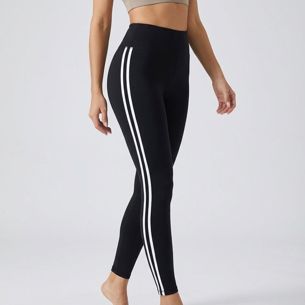 Women's black high-waisted performance leggings by Paige, designed for active comfort