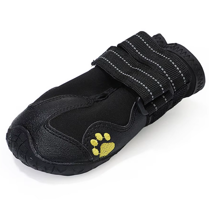 Close-up of waterproof dog boot showing textured anti-slip sole and secure strap for outdoor gear