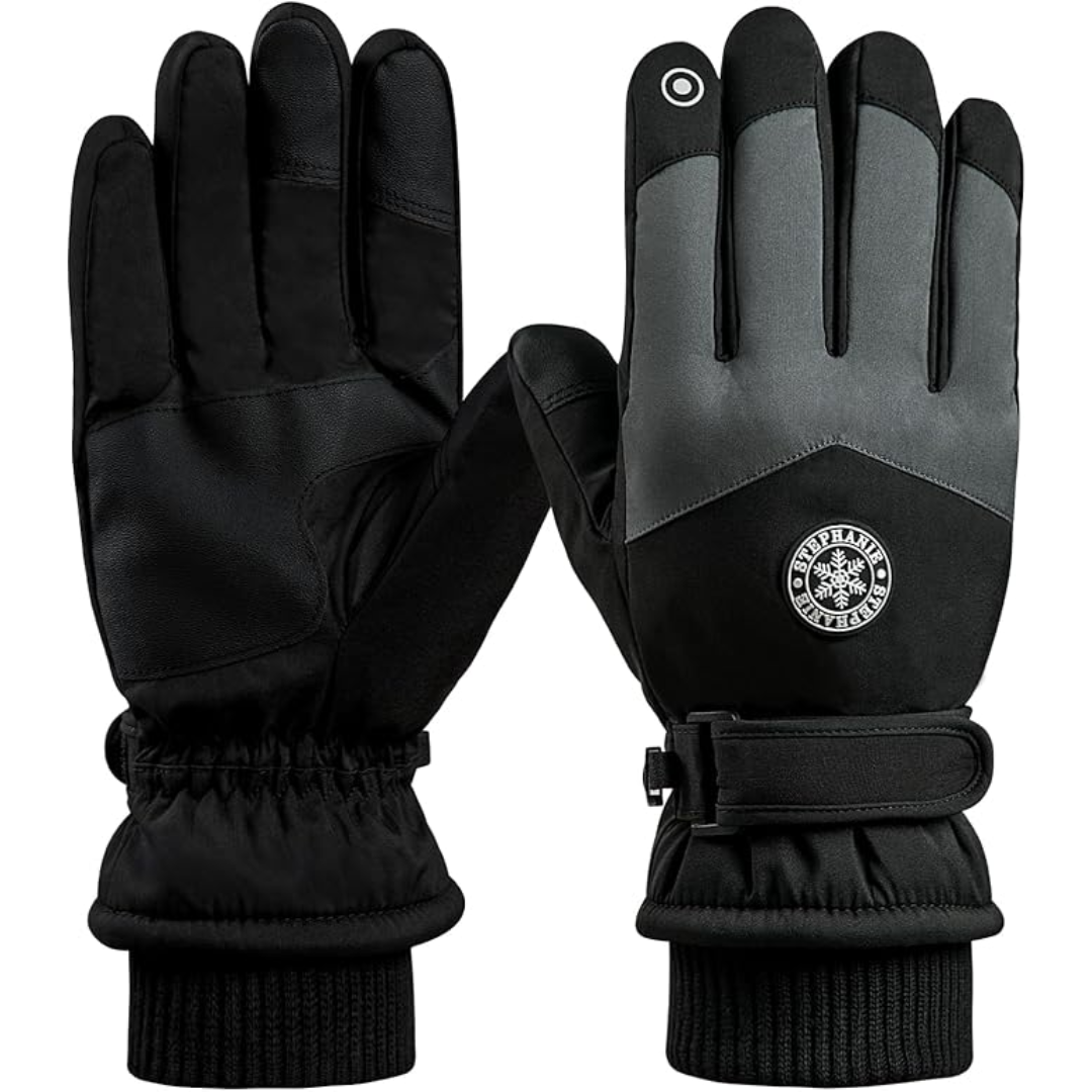 Close-up of a hand wearing a black ThermaTouch winter glove, showing touchscreen compatibility