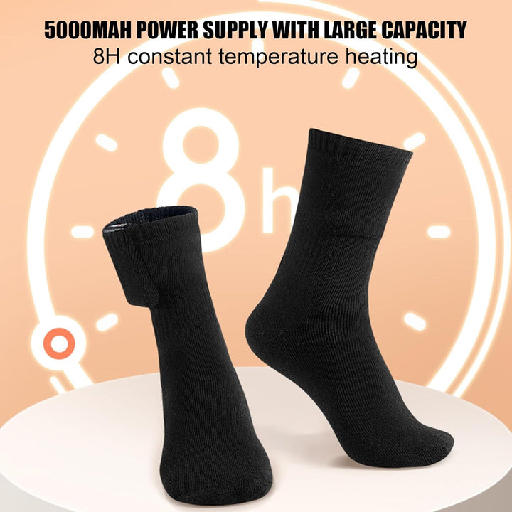 Model wearing black USB rechargeable heated thermal socks, suitable for various winter sports.