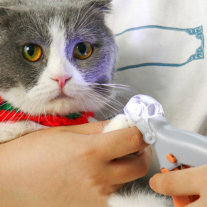 Ergonomic pet nail clippers with LED light & quick sensor for precise, stress-free dog and cat paw grooming at home.