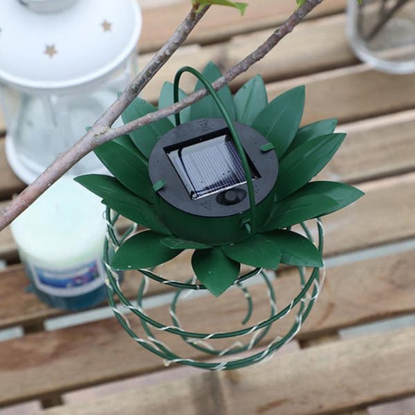 Bright LED pineapple solar garden light. Enhance your outdoor space with tropical patio decor.