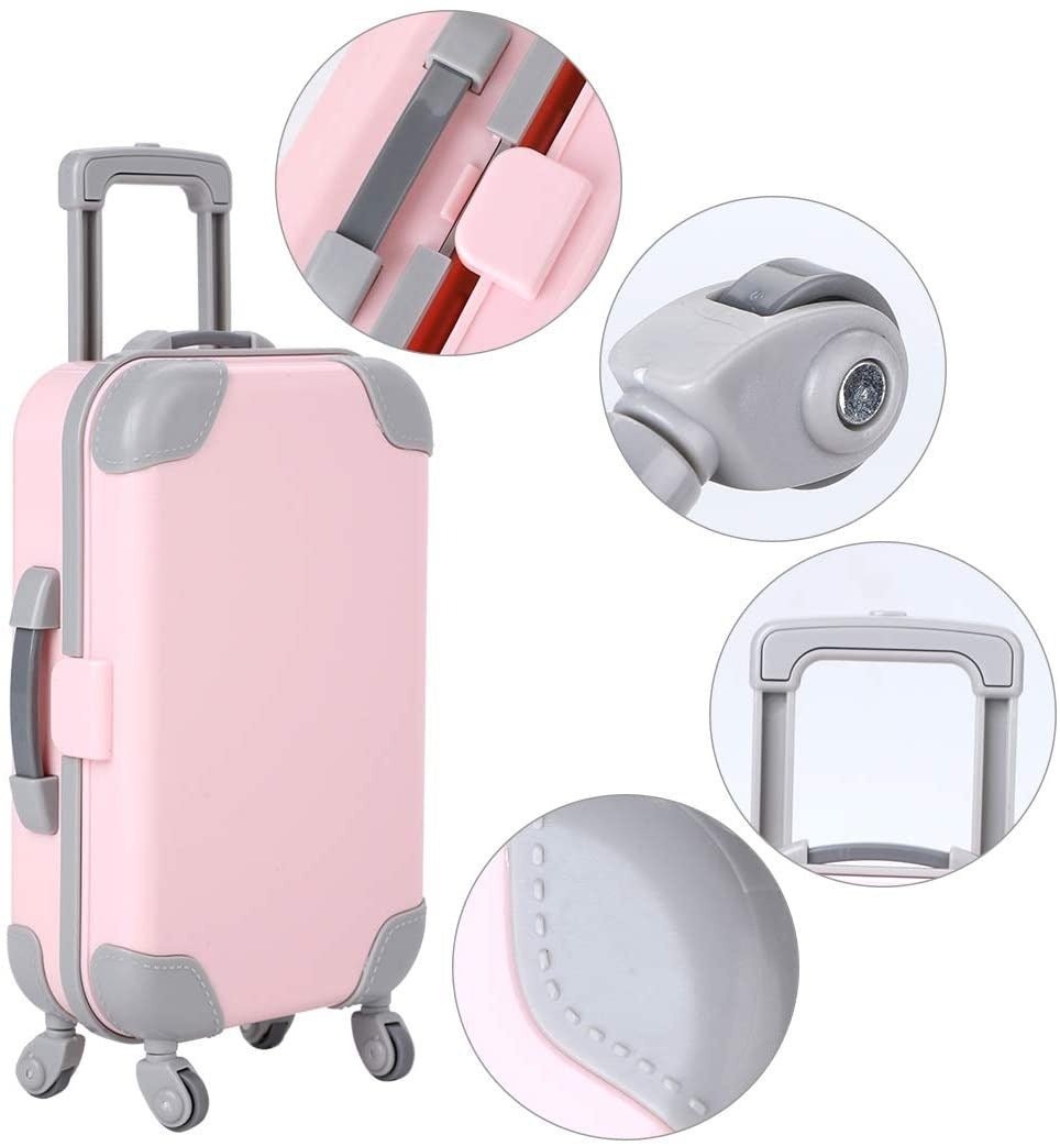Child playing with a doll and its pink travel suitcase; encourages pretend play for 18-inch dolls.