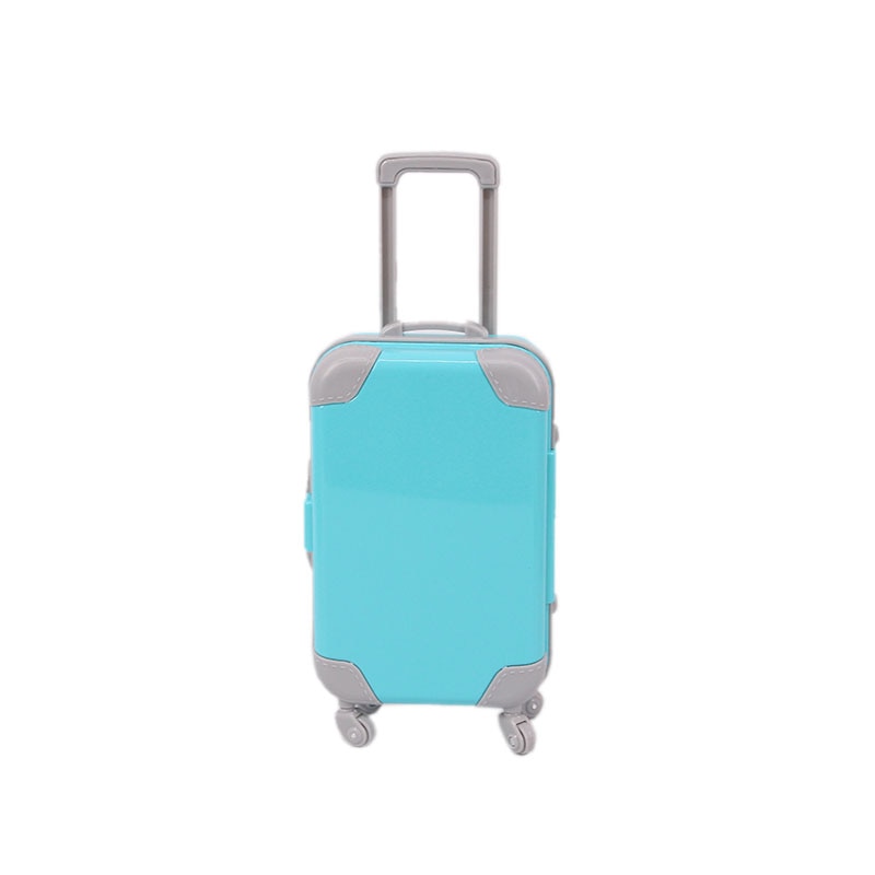 Close-up of a pink doll suitcase handle; sturdy doll accessory for 18-inch dolls, girls' toy.