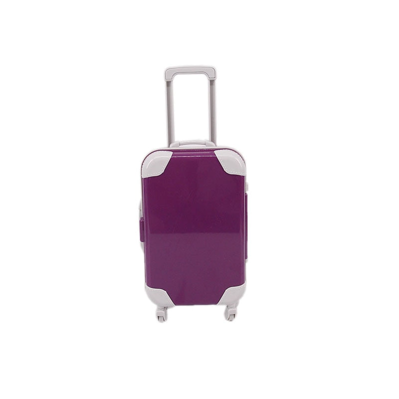 Open doll suitcase revealing tiny clothes and accessories; great toy storage for 18-inch dolls' outfits.