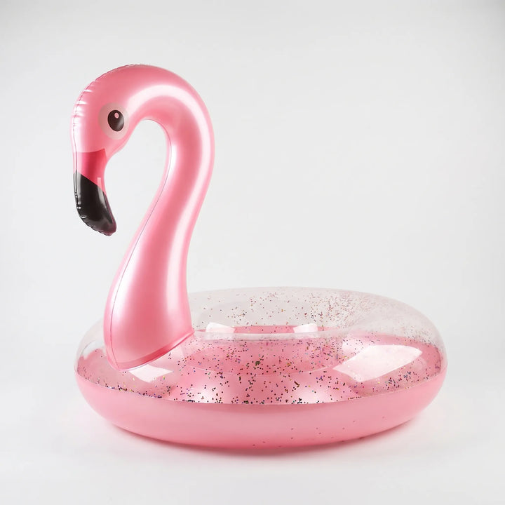 Glitter inflatable flamingo pool float, a fun summer toy and beach accessory for water activities.