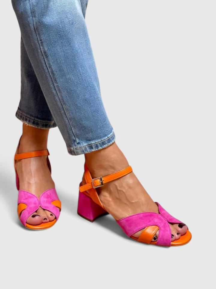 Women's fashion pink wedge sandals featuring an adjustable strap, ideal comfortable summer footwear for casual outings.