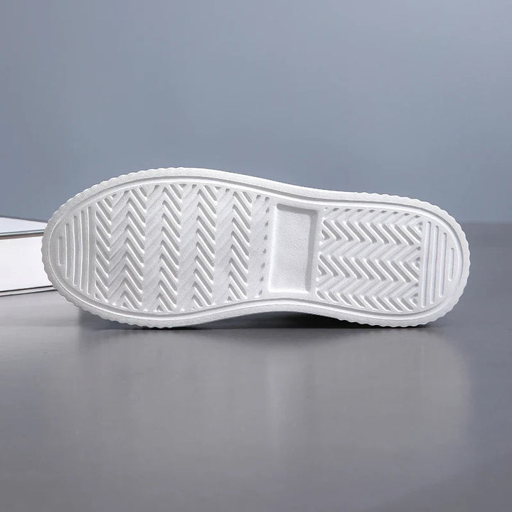 Trendy women's glossy lace-up sneakers, combining athletic style with comfortable fashion footwear.