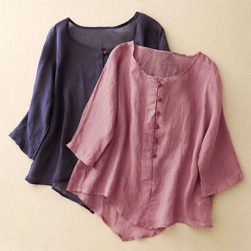 Graceful flowy women's blouse in a soft pink, ideal for casual chic or sophisticated everyday style.