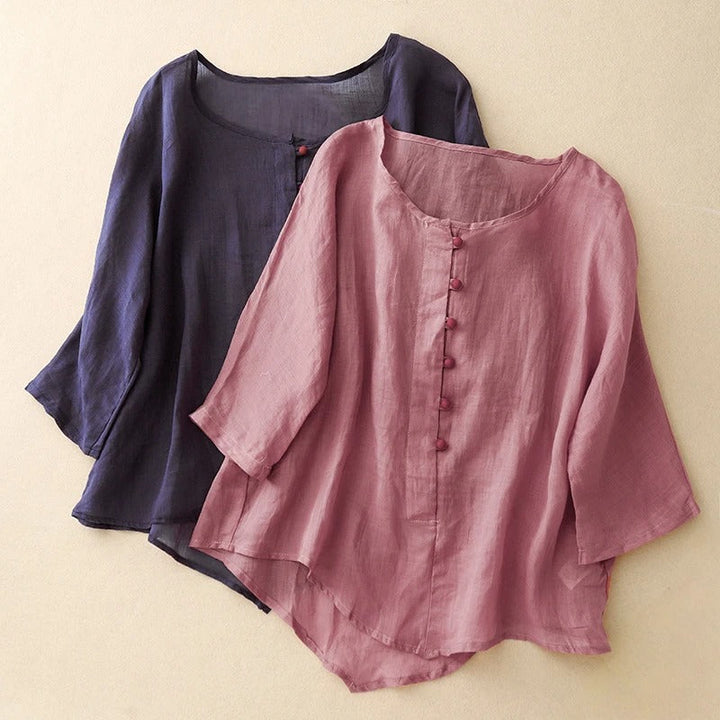 Graceful flowy women's blouse in a soft pink, ideal for casual chic or sophisticated everyday style.