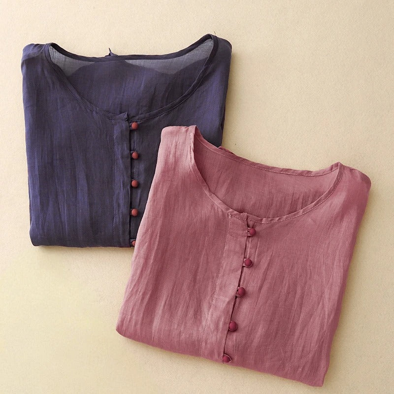 Elegant navy blue women's button-front blouse with a round neck, a versatile and comfortable everyday top.