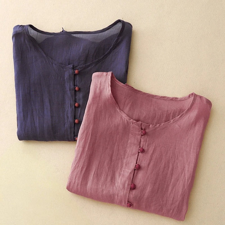 Elegant navy blue women's button-front blouse with a round neck, a versatile and comfortable everyday top.