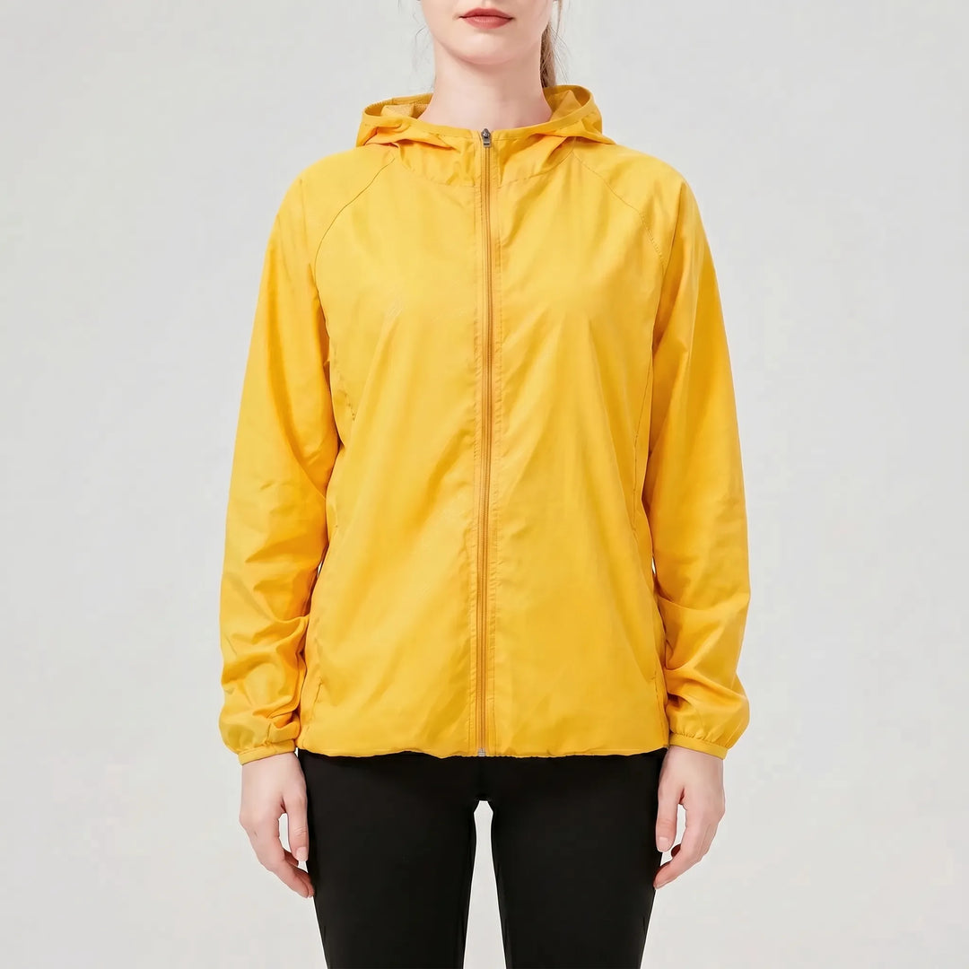 Essential green women's lightweight hooded activewear jacket, a packable windbreaker for outdoor & travel.
