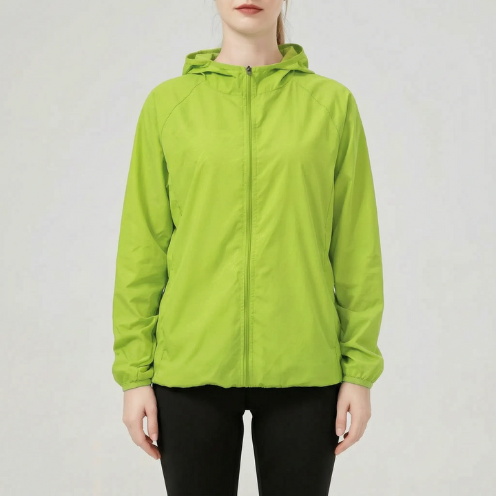 Orange women's versatile lightweight hooded jacket, an active windbreaker & rain jacket for hiking and travel.
