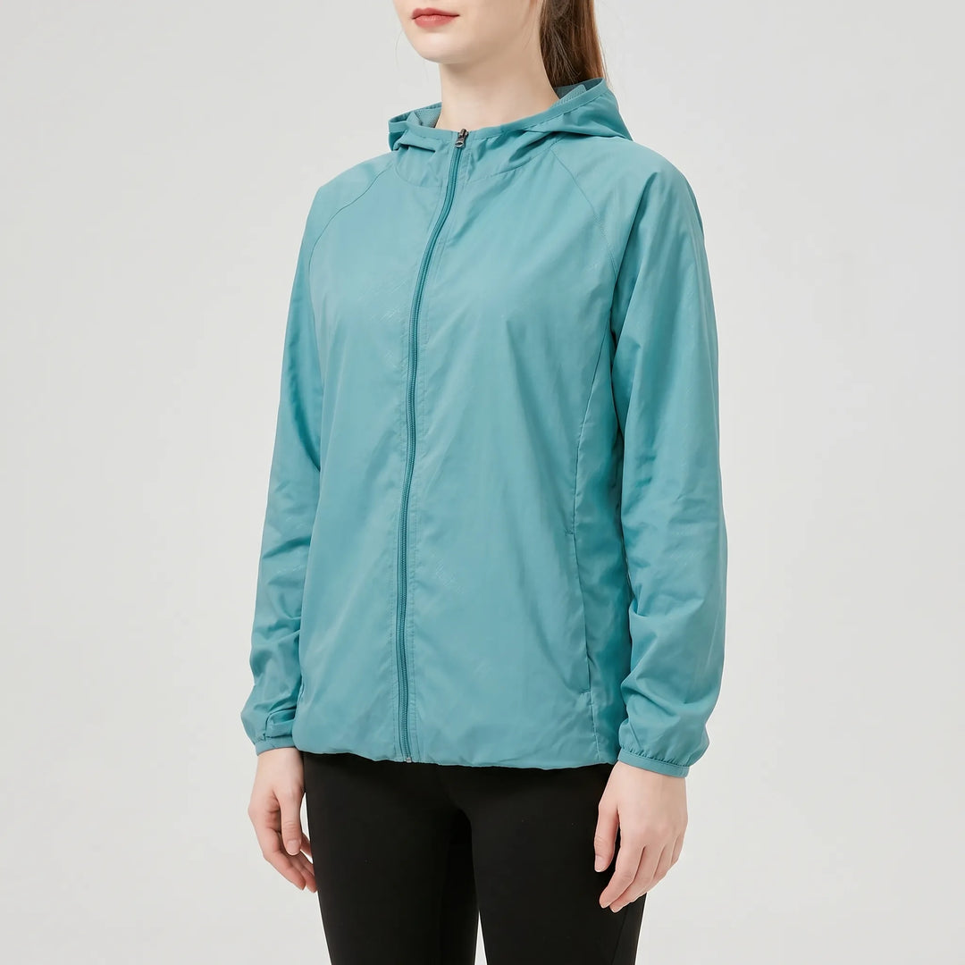 Yellow women's lightweight hooded outdoor performance jacket, ideal activewear for hiking, travel, and rain.