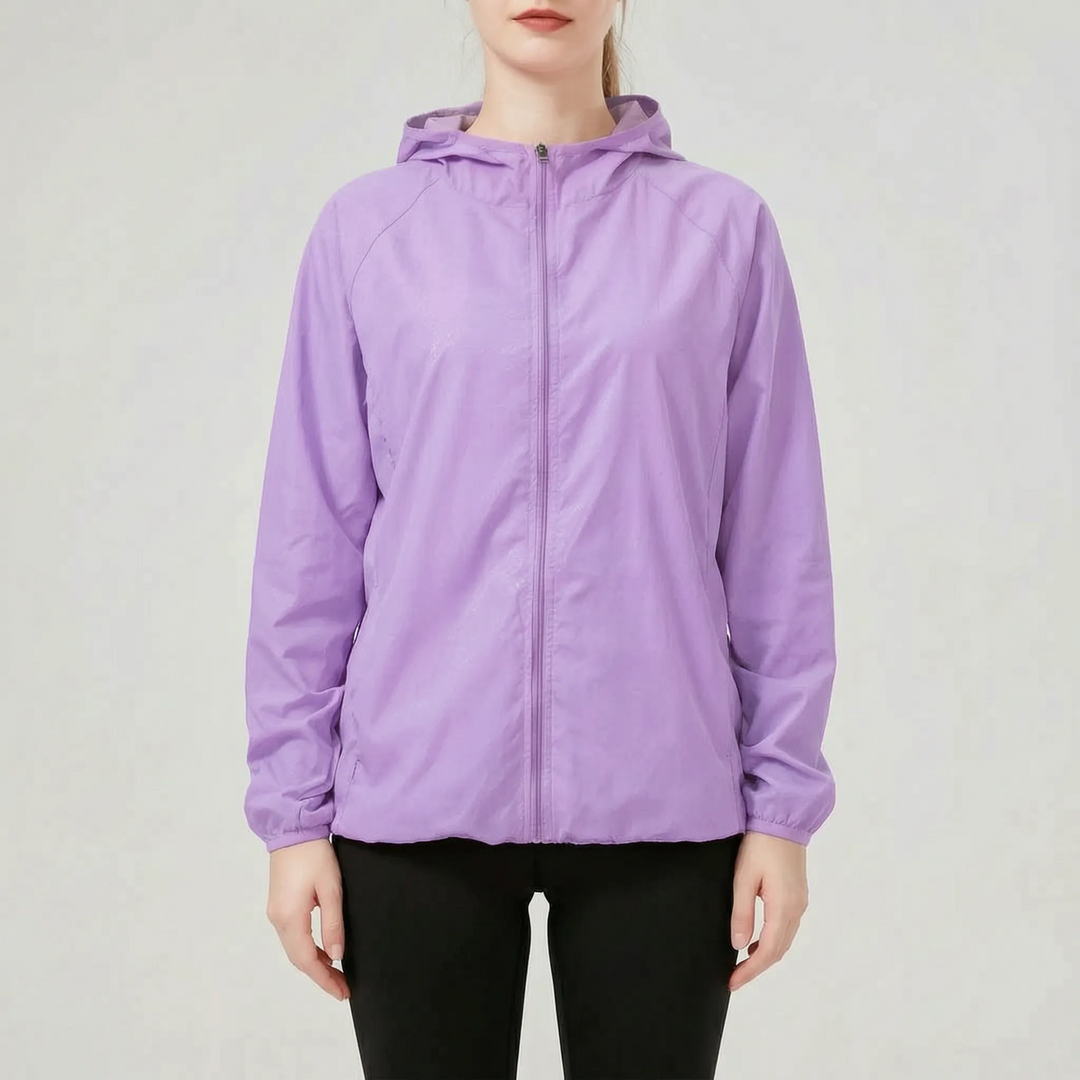 Stylish pink women's lightweight hooded active jacket, a packable windbreaker and rain jacket for any adventure.