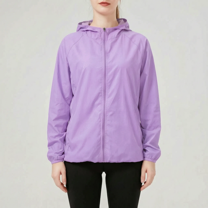 Stylish pink women's lightweight hooded active jacket, a packable windbreaker and rain jacket for any adventure.
