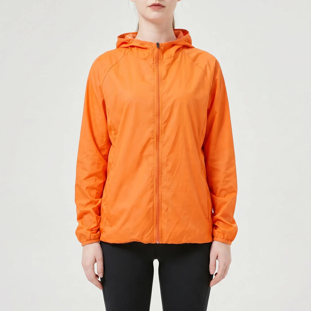 Durable blue women's lightweight hooded jacket, an active outdoor windbreaker & rain jacket perfect for hiking.