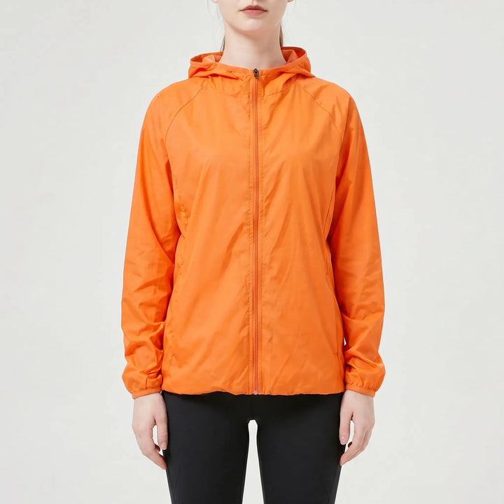 Durable blue women's lightweight hooded jacket, an active outdoor windbreaker & rain jacket perfect for hiking.