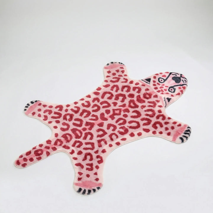 Modern plush pink leopard print accent rug. Stylish Flowique wavy floor decor for living room, bedroom, or kids room.