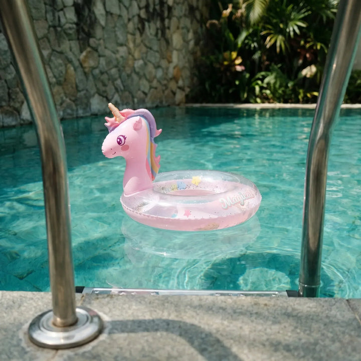 Playful pink unicorn inflatable pool float with rainbow mane, perfect for summer water fun and kids' outdoor play.