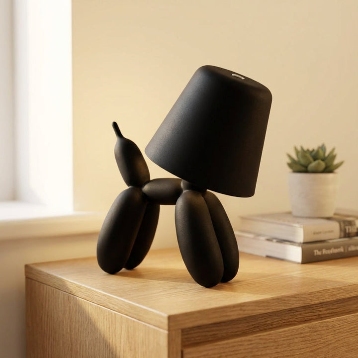 Playful red balloon dog LED table lamp, touch controlled, adding modern decor & ambient light to a room.
