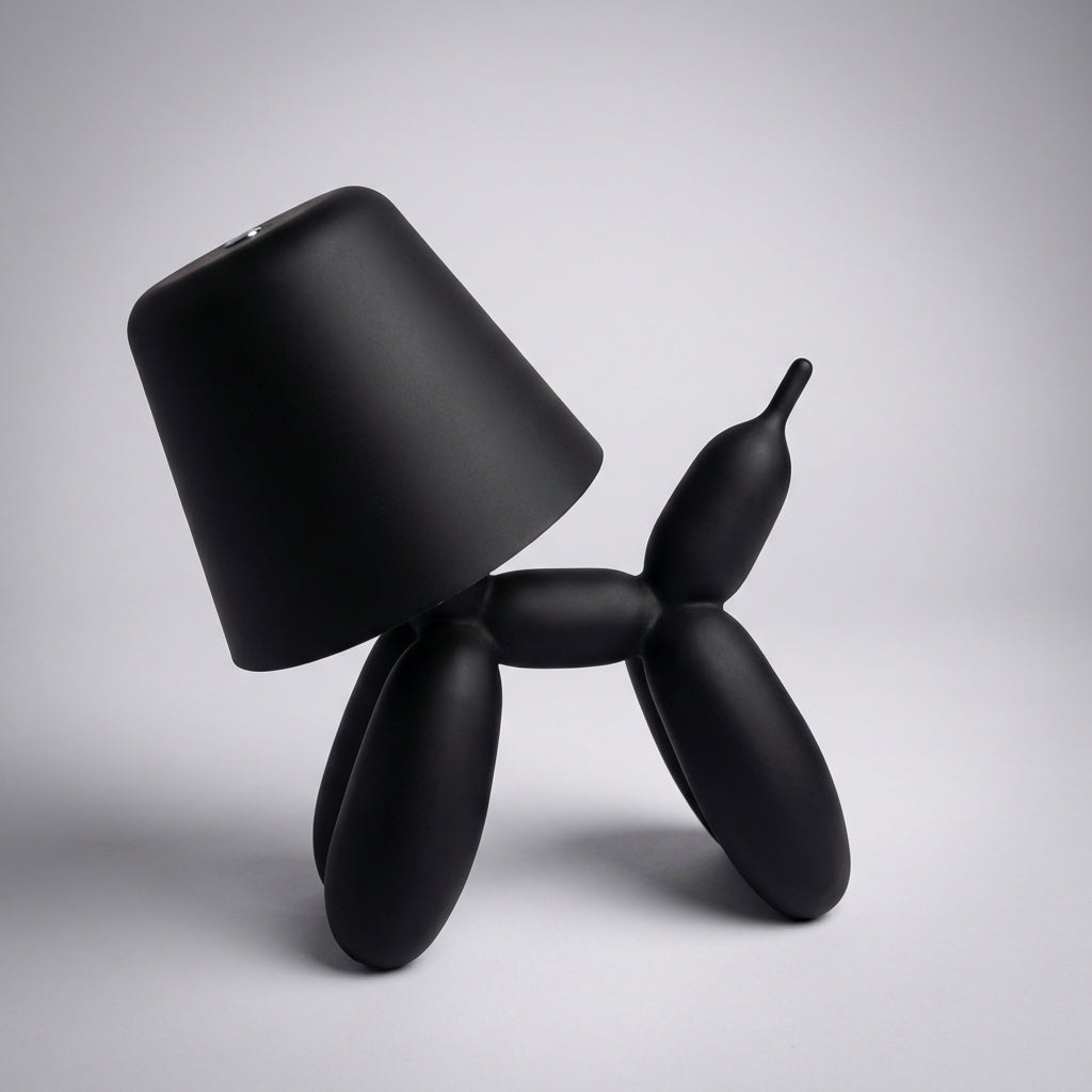 Luminpup rechargeable LED balloon dog lamp in an elegant black finish, perfect as a portable sculptural light.