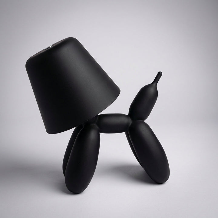 Luminpup rechargeable LED balloon dog lamp in an elegant black finish, perfect as a portable sculptural light.
