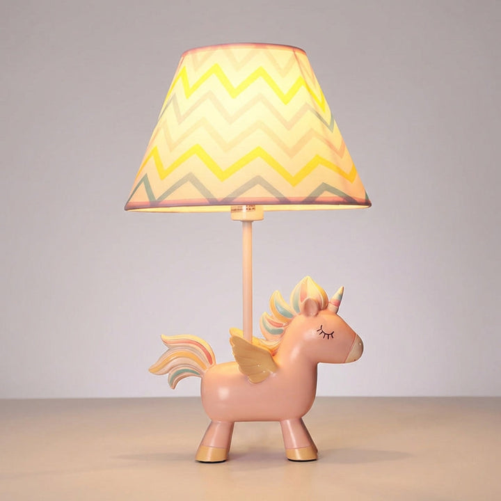 Close-up of a Lumicorn unicorn table lamp, featuring a soft glow for children's bedroom lighting