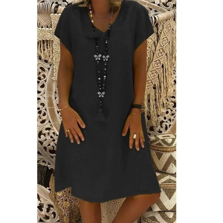Women's plus size flowy summer day dress, soft comfortable fabric, relaxed fit, multiple colors.