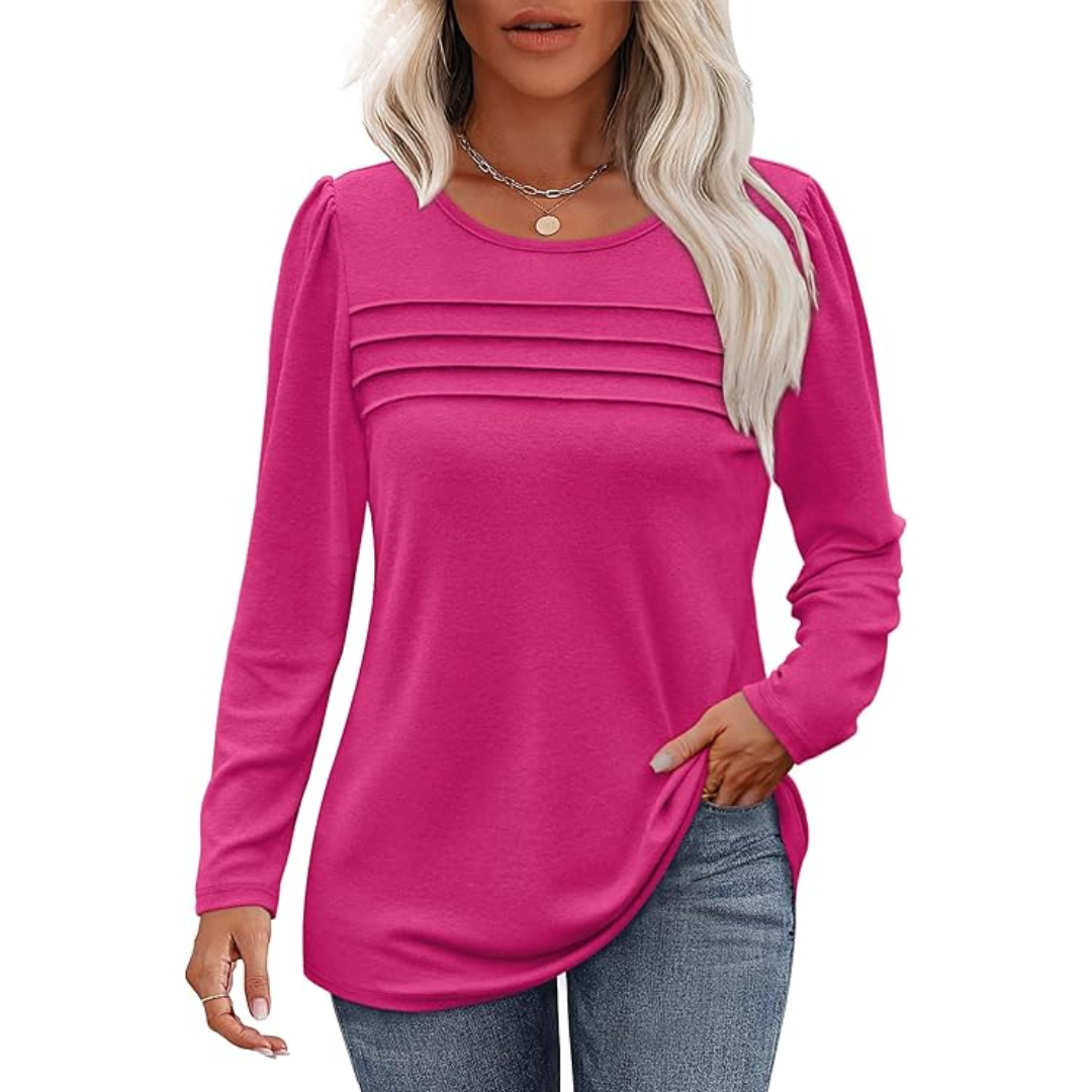 Back view of a women's pleated long sleeve tunic, emphasizing its flowing silhouette