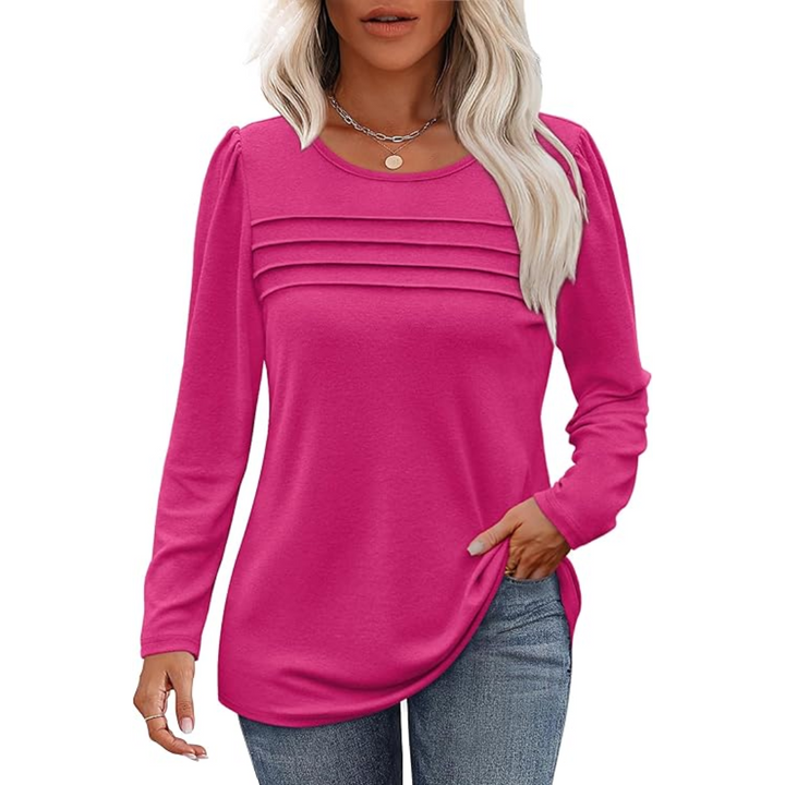 Back view of a women's pleated long sleeve tunic, emphasizing its flowing silhouette
