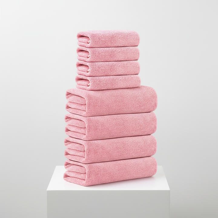Blush pink hand towel from an 8-piece coral velvet set, showcasing its soft, absorbent, and luxury qualities