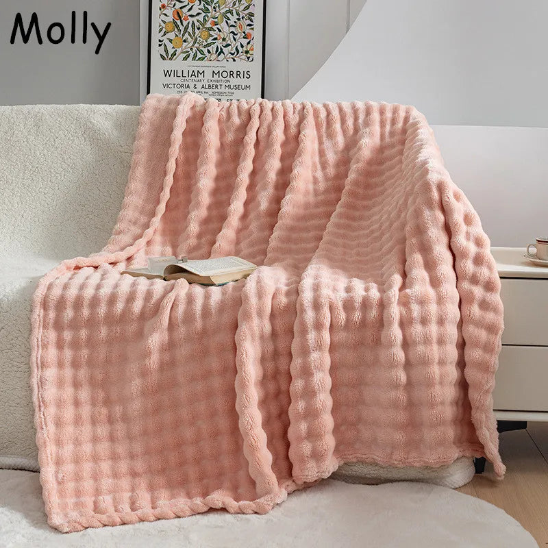 Plush Bubble Flannel Blanket in a cozy living room setting. Ultra soft throw for warmth & comfort.